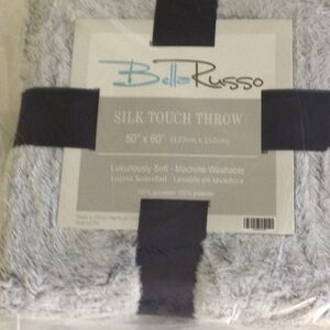 Home Silk Touch Throw luxuriously soft. Machine wash. 50” X 60”.